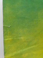 Textured green and yellow paper with a white border