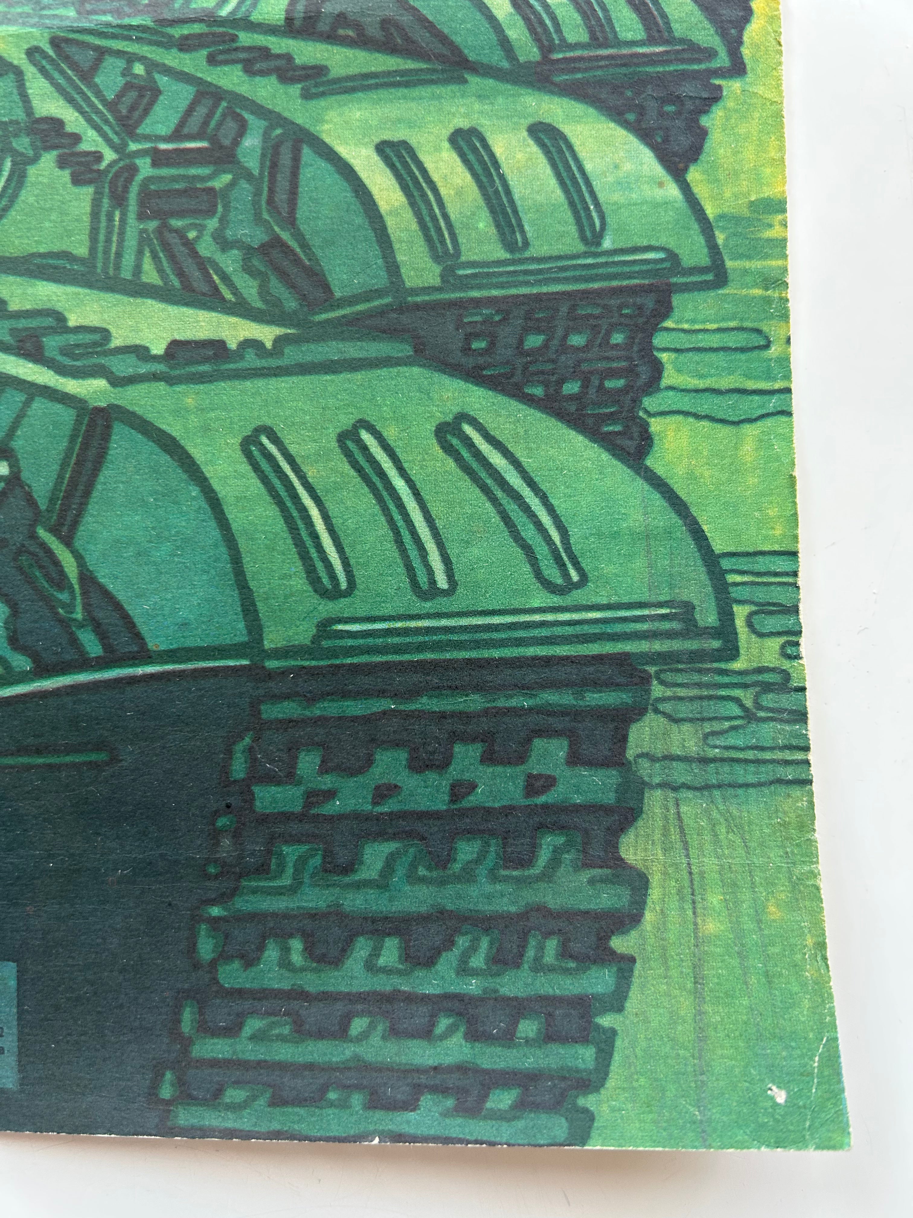 Close-up of green tank-like structures on a textured surface