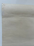 Beige textured paper on a light gray background