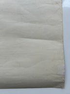 Close-up of a textured beige fabric on a white background