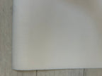 White sheet of paper on a textured surface