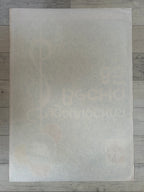 White sheet of paper with text on a wooden surface