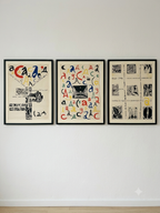 Three framed artworks with abstract designs on a white wall.