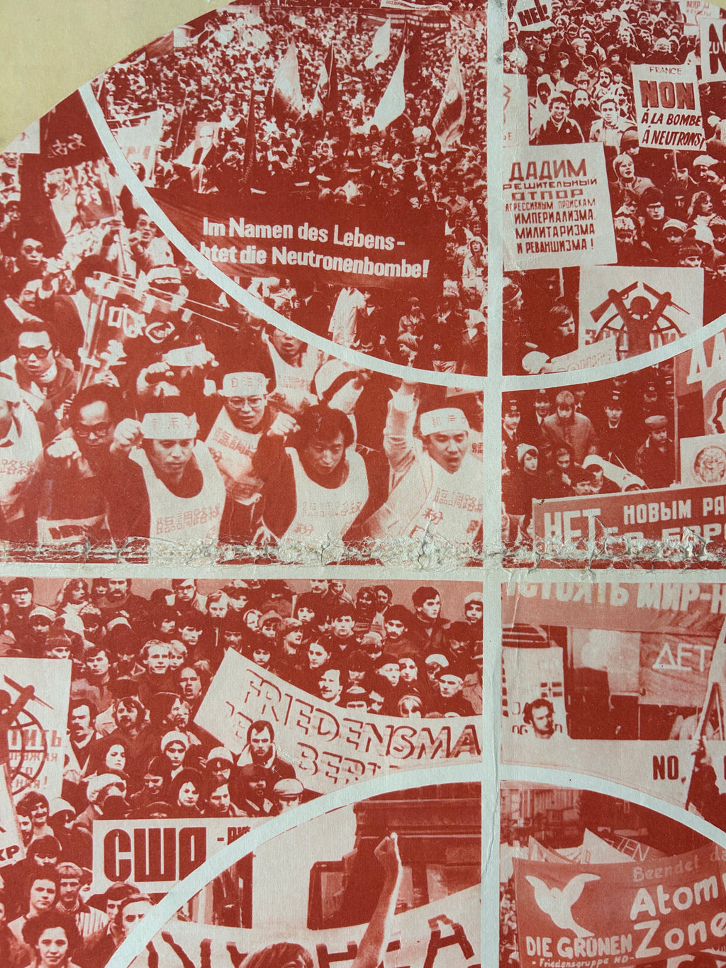 A close-up of a printed textile or wallpaper pattern featuring a collage of protest scenes in red and black-and-white tones, with curved white dividing lines and repeated banners and faces.