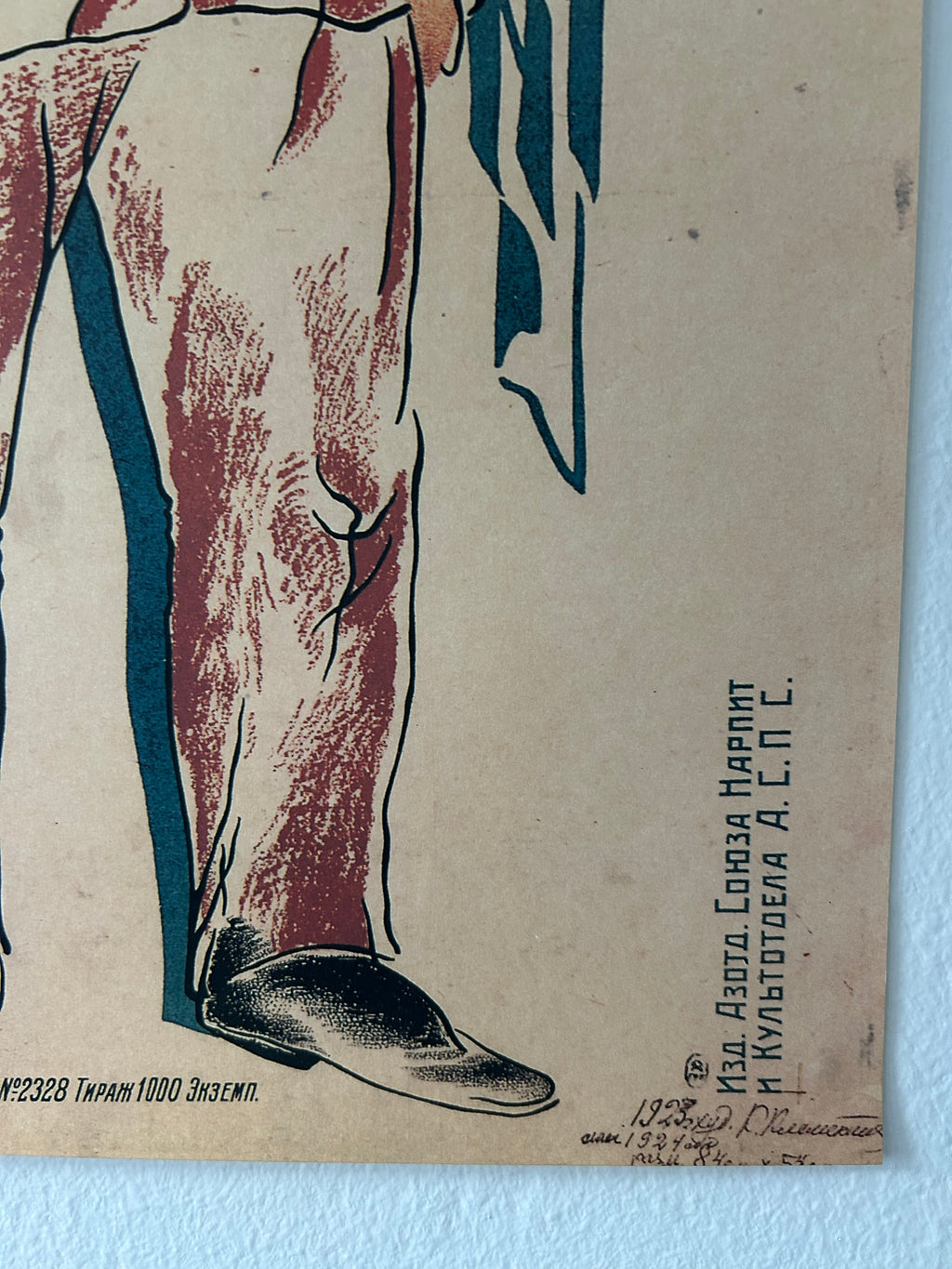 Vintage illustrated print or poster showing a close-up of a person's leg and foot, with blue and reddish-brown linework on a beige background. Part of a person's body is visible at the lower left, and there is mirrored text near the top right.