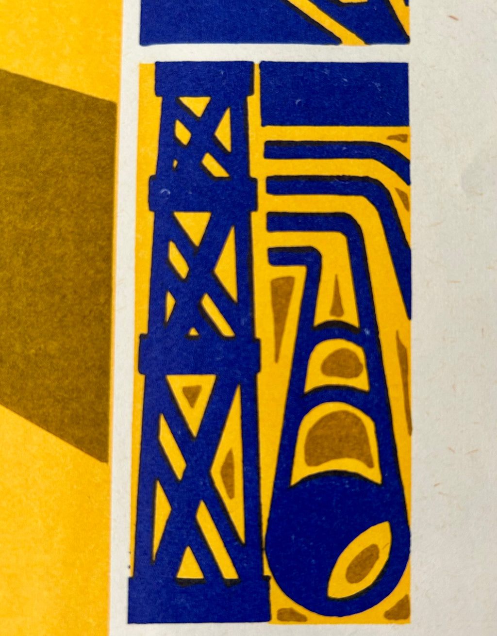 A close-up of a graphic art print featuring a stylized blue and yellow illustration of an oil derrick and a wellhead, with a white border and a yellow geometric shape on the left.