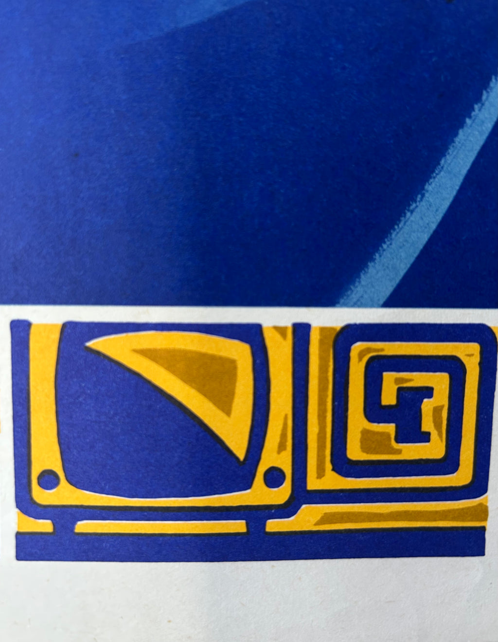 A close-up of a blue and yellow graphic design, likely a logo or emblem, featuring a stylized screen and geometric pattern on a white background.