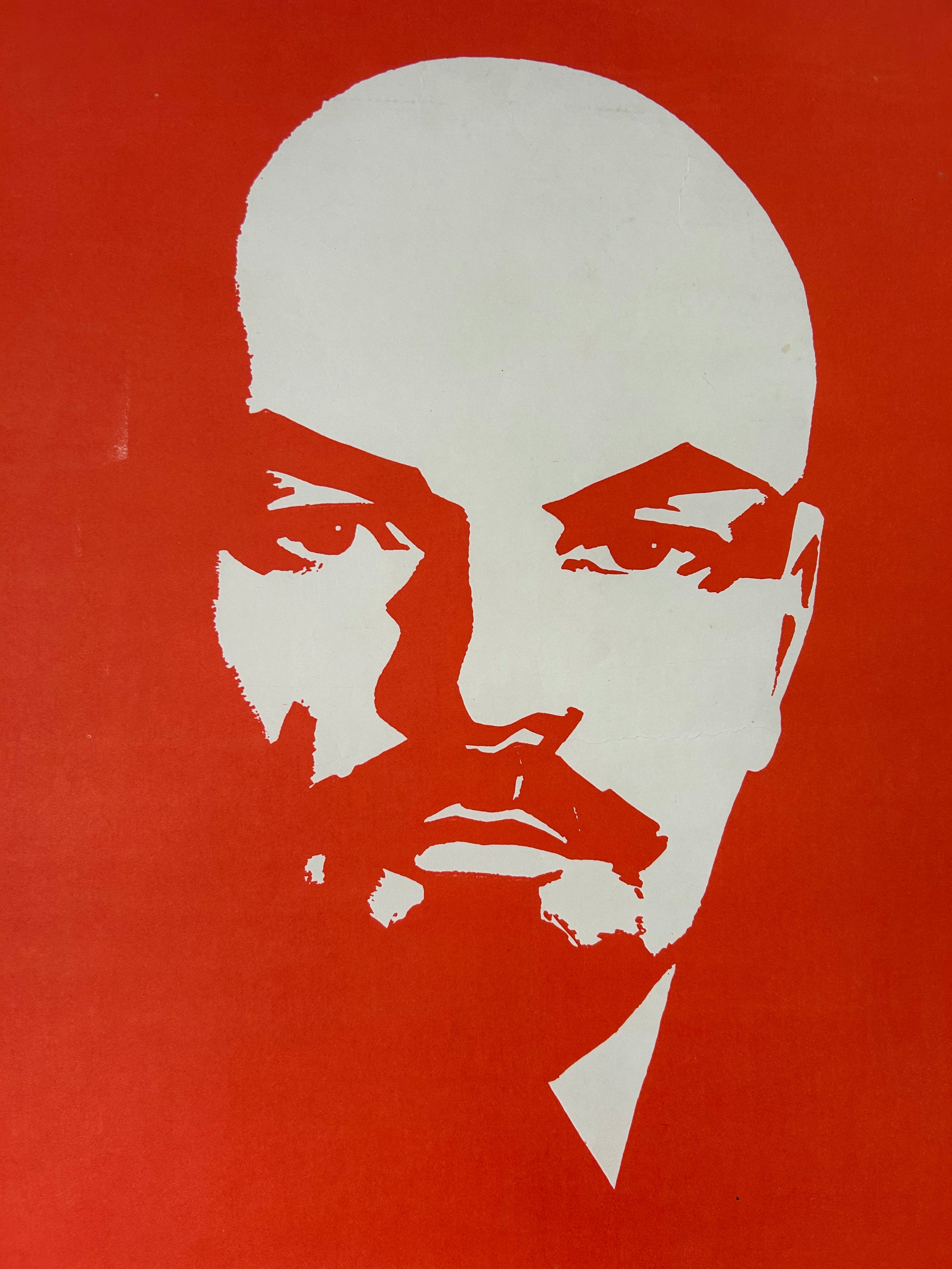 A graphic art print featuring a stylized white portrait of Vladimir Lenin on a solid red background.