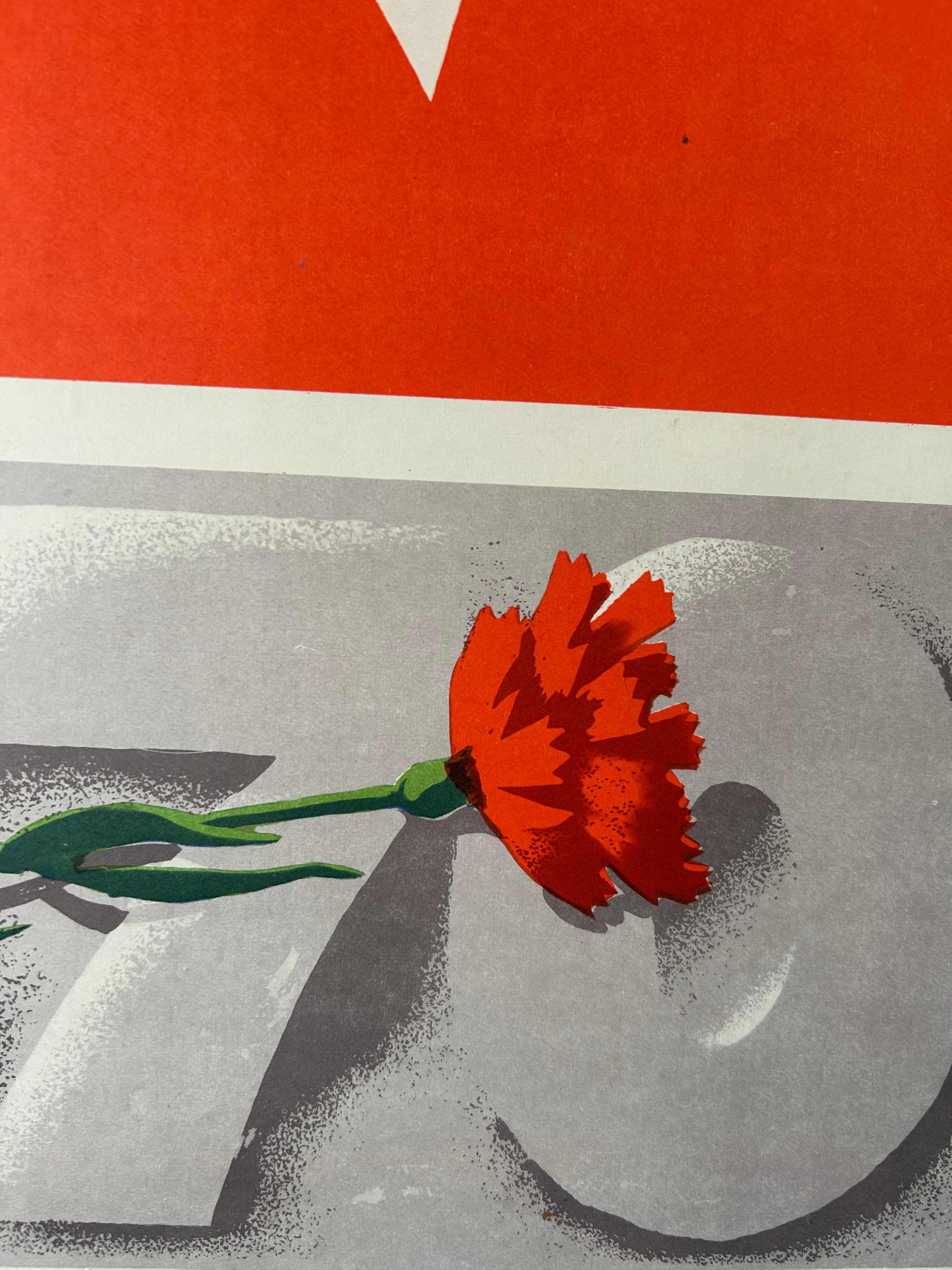 A close-up of a graphic art print featuring a single red flower with a green stem resting on a gray textured surface, with a bold red and white block at the top.