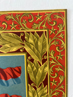 Close-up of a vintage-style decorative border with red and gold ornamental scrollwork and leaf motifs, alongside a partial blue panel with red and blue graphic elements.